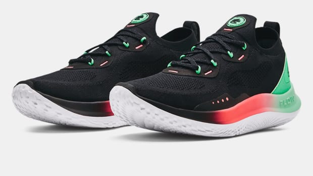 View of black, green, and red Curry Brand running shoes.